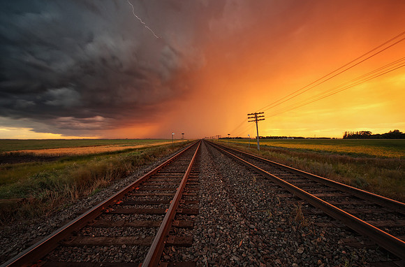 Sunset Storm Over The Railroad Tracks